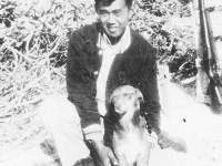 Soldier with dog on Cat Island, Mississippi. [Courtesy of Mrs. William Takaezu]