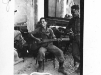 Soldiers play music while in Italy. Conrad Tsukayama on guitar. (Courtesy of Alvin Tsukayama)