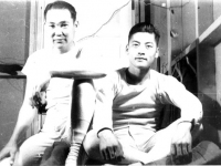 Sgt. Wilfred Maki (right) and I, taken in our room in our woolen undies. Camp McCoy, Wis. Oct. 1942. In the fall, the 100th moved into new barracks. Sgt. Shiro Maki and I share a room in the new building.  [Courtesy of Janice Uchida Sakoda] [Courtesy of Janice Uchida Sakoda]