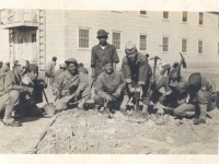 Shinyei Nakamine digs with a shovel with other soldiers while building the barracks at Camp McCoy, Wisconsin. (Courtesy of Anita Korenaga)