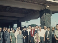 Takeshi Teshima with lei.  His former B Company comrade and best friend, James Kengo Miyano, is behind his right shoulder.  Friends and business associates from Japan.  [Courtesy of Ted Teshima]