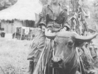 Some MIS friends ride a carabao in the Philippines.[Courtesy of Florence Matsumura]