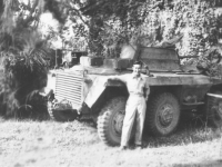 Tom Matsumura poses with a tank while stationed in the Philippines. [Courtesy of Florence Matsumura]