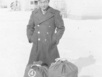 Tom Matsumura with his bags on his last day at Camp McCoy, Wisconsin. [Courtesy of Florence Matsumura]
