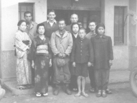 Tom Matsumura with a Japanese family. [Courtesy of Florence Matsumura]