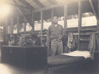 Toshiro Morishige next to his bunk at Camp McCoy, Wisconsin. [Courtesy of Morishige Family]