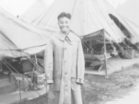 Joe Nakahara in his trenchcoat at Camp McCoy, Wisconsin, 1942. [Courtesy of Velma Nakahara]