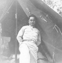 Dr. Richard Kainuma in front of his tent at Camp McCoy, Wisconsin, 1942 [Courtesy of  Bob Kainuma]