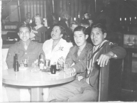 Yozo Yamamoto and friends take in a show at the Lexington Hotel while on furlough in Wisconsin, from l-r James Akamine; hula dancer; James Oki; Yozo Yamamoto [Courtesy of Sandy Tomai Erlandson]